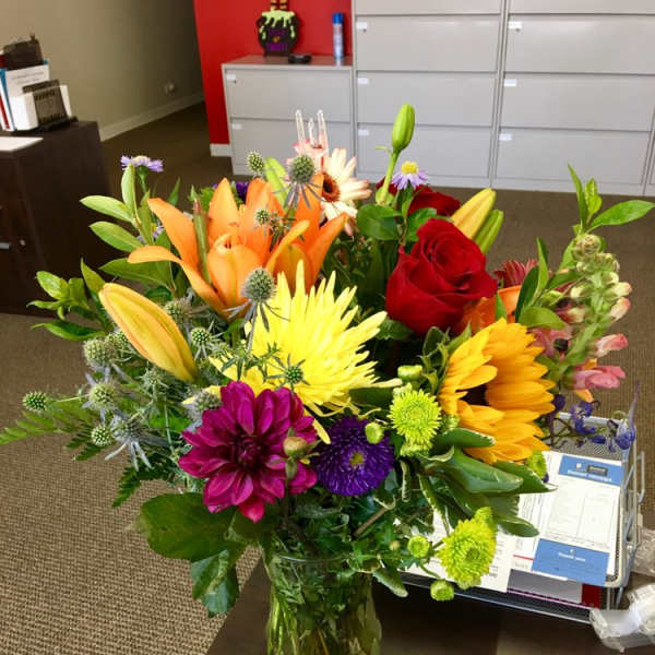 Colorful mixed bouquet in a clear glass vase