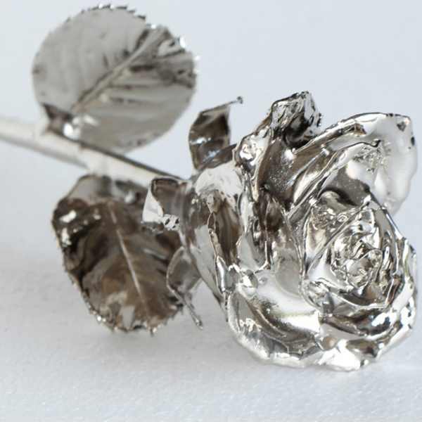 Silver rose-shaped decorative picks on stems