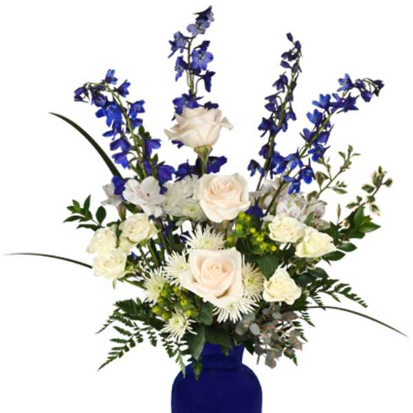 Blue and white floral arrangement in a cobalt vase