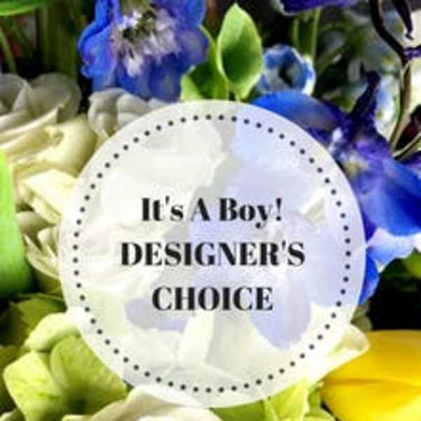 Mixed bouquet with blue, white, and green flowers and a baby boy card