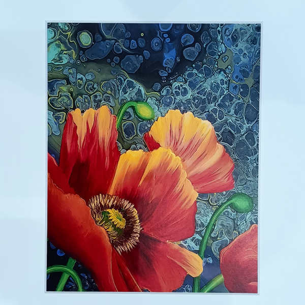 Framed art print of red and orange poppy flowers on an abstract blue background