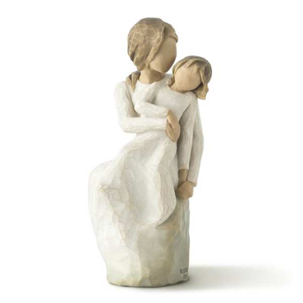 Carved figurine of a woman holding a child