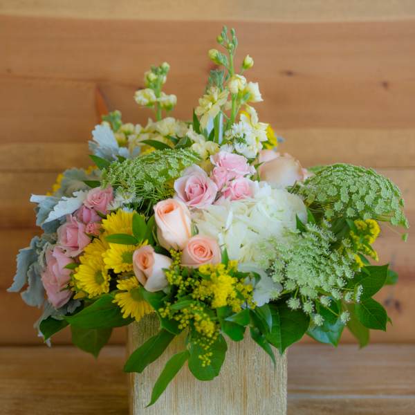 Mixed pastel bouquet in a square gold vase