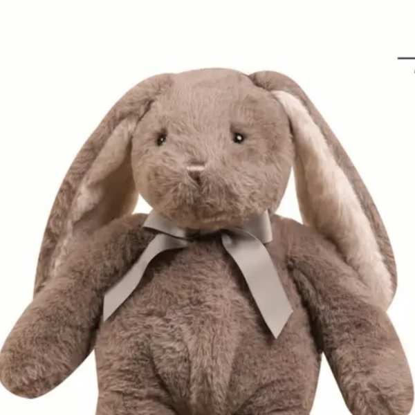 Brown plush bunny with long floppy ears and a ribbon bow