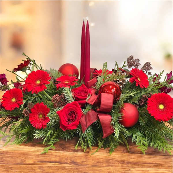 Red floral centerpiece with candles and ornaments