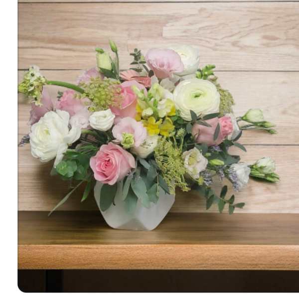 Pink and white mixed bouquet in a white vase