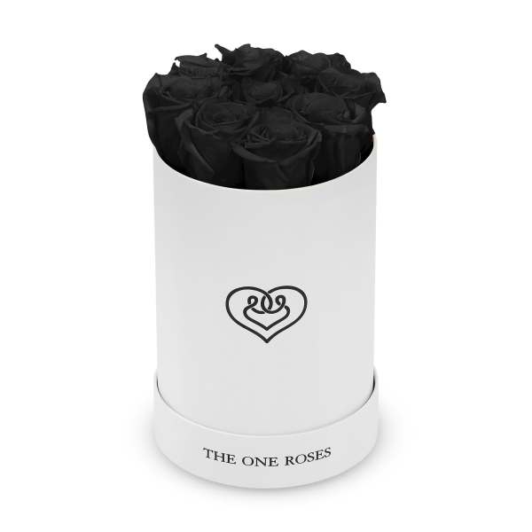Black roses arranged in a white cylindrical box