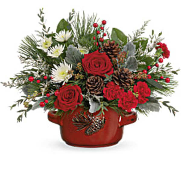 Red roses and white flowers in a red ceramic pot with pinecones