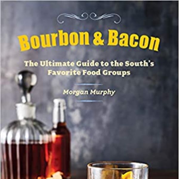 Book cover with bourbon bottles, a whiskey glass, and bacon on a plate