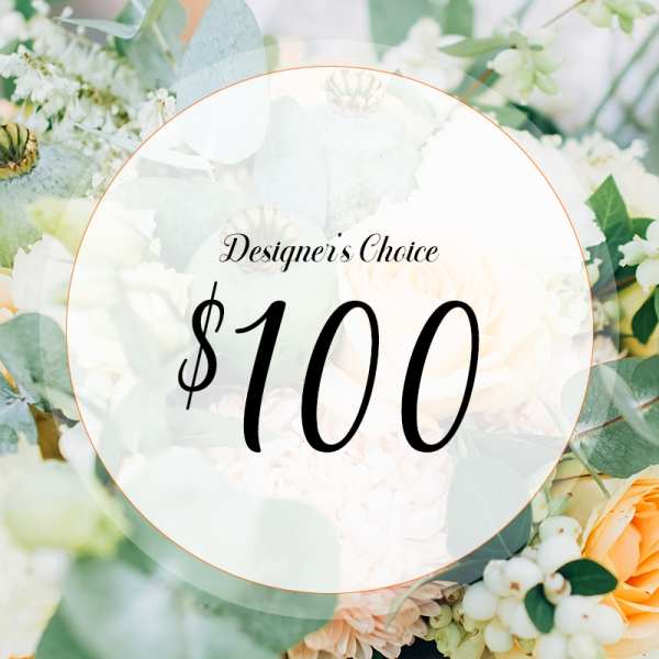 Designer’s choice floral arrangement with white and peach blooms