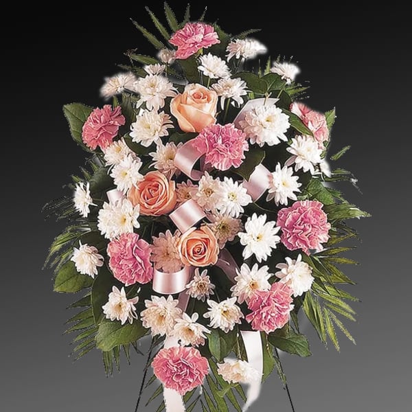 Pink and white floral standing spray with roses and carnations