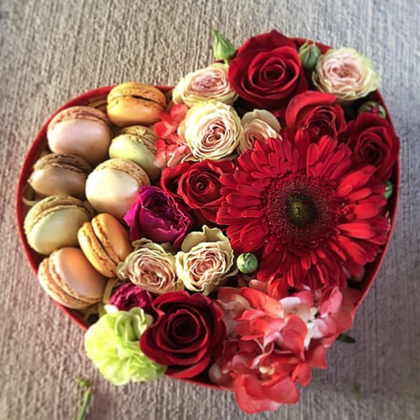 Heart-shaped box with roses, gerbera daisy, and macarons