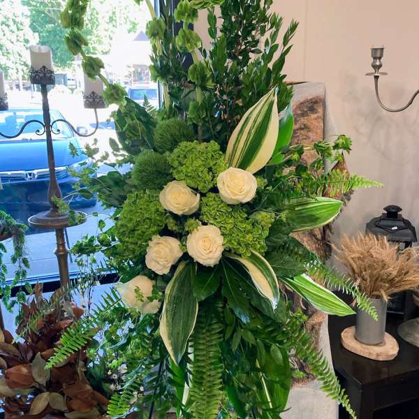 Elegant Green And White Sympathy Stand