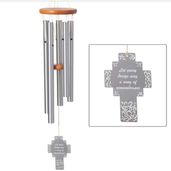Silver wind chime with a cross-shaped hanging tag