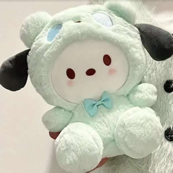 Mint plush sheep toy with a blue bow