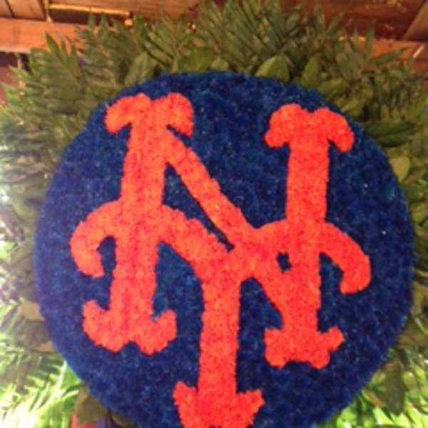 Blue and orange floral tribute with a Mets logo