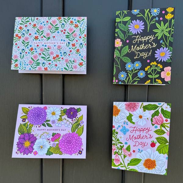 Set of four colorful Happy Mother's Day greeting cards with floral illustrations