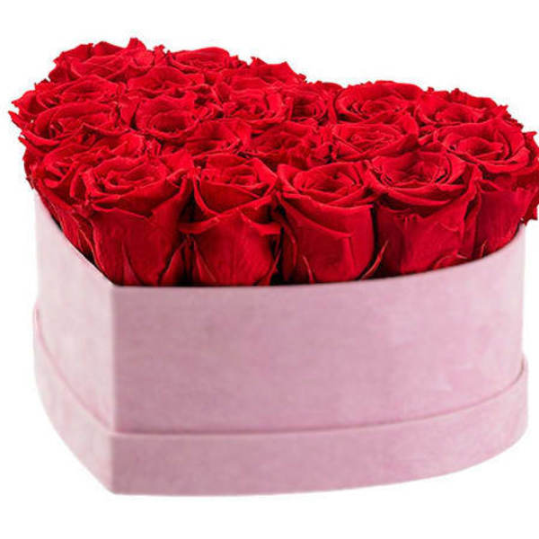Heart-shaped box of red roses with a pink wrap