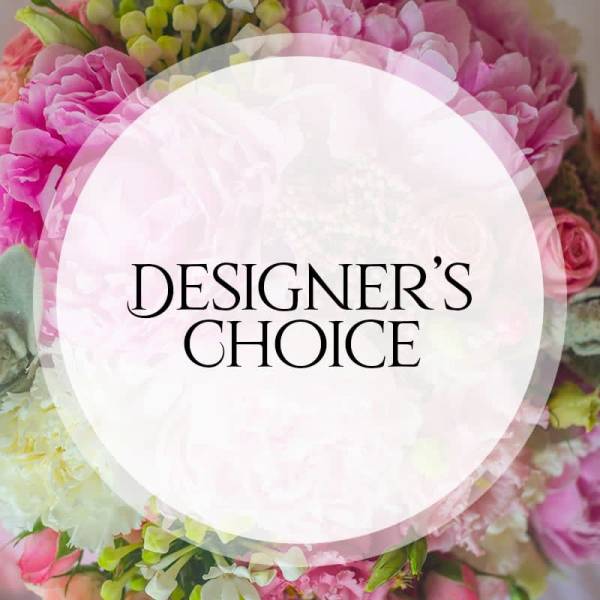 Pink floral arrangement with a "Designer’s Choice" label