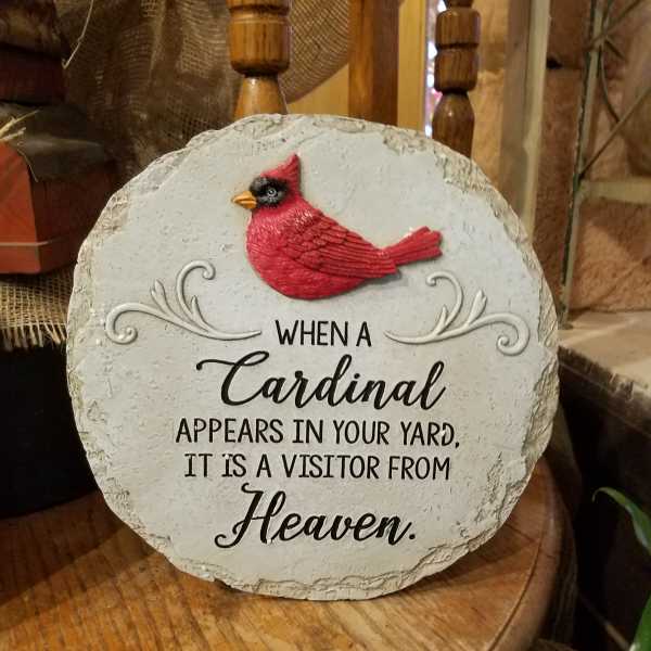 Decorative stone plaque with a red cardinal and memorial text