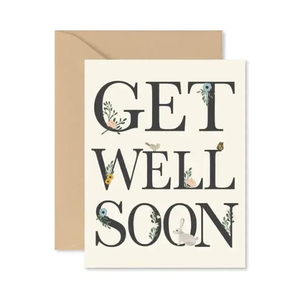 Get well soon greeting card with floral accents and a bunny illustration
