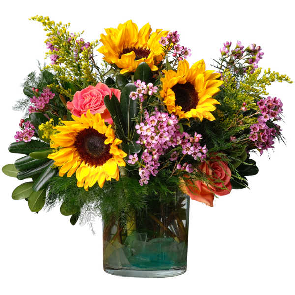 Sunflowers and pink roses in a glass vase