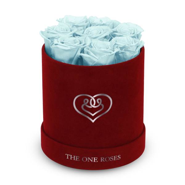 Blue roses in a red round box with a heart emblem
