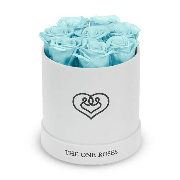 Light blue roses in a white round box with a heart logo