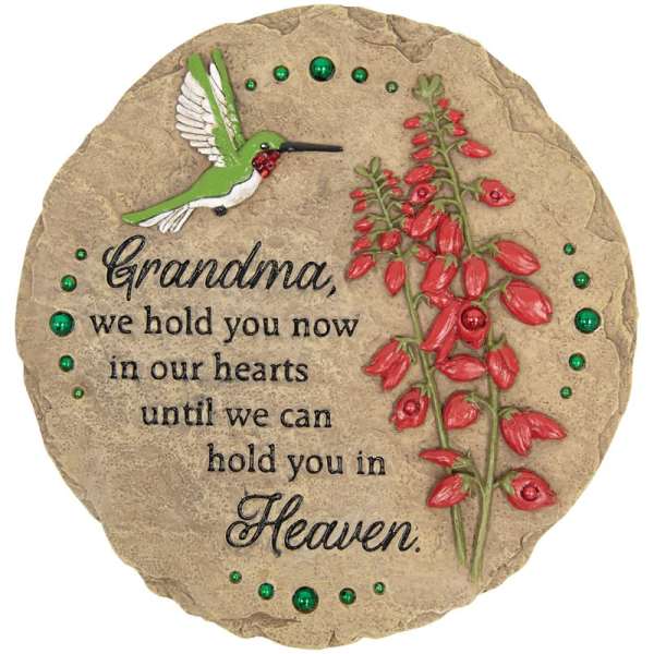 Round memorial stone for grandma with hummingbird, red floral design, and engraved remembrance message