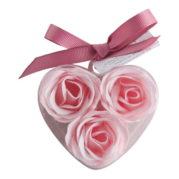 Heart-shaped box with three pink rose-shaped soaps and a ribbon bow