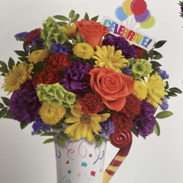 Colorful bouquet in a party cup with balloons and a "CELEBRA EL" topper