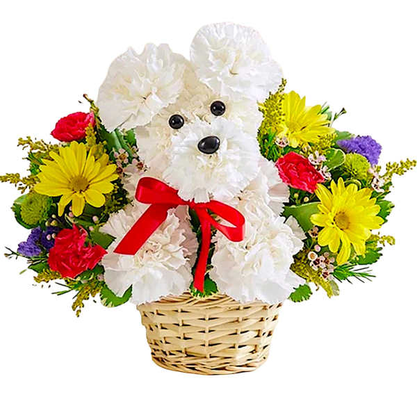 White teddy bear in a basket surrounded by colorful flowers