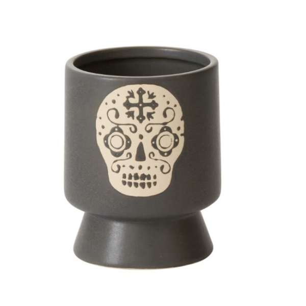 Black ceramic candle holder with a skull design