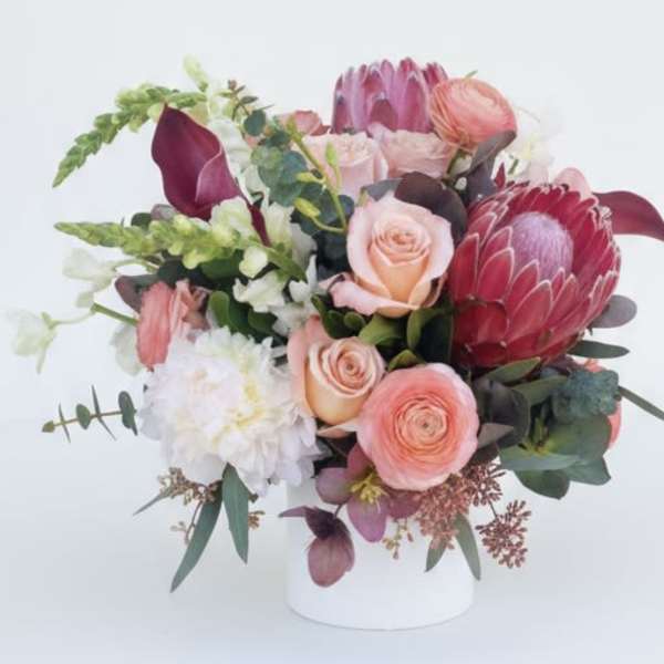 Mixed pink and white bouquet in a white vase
