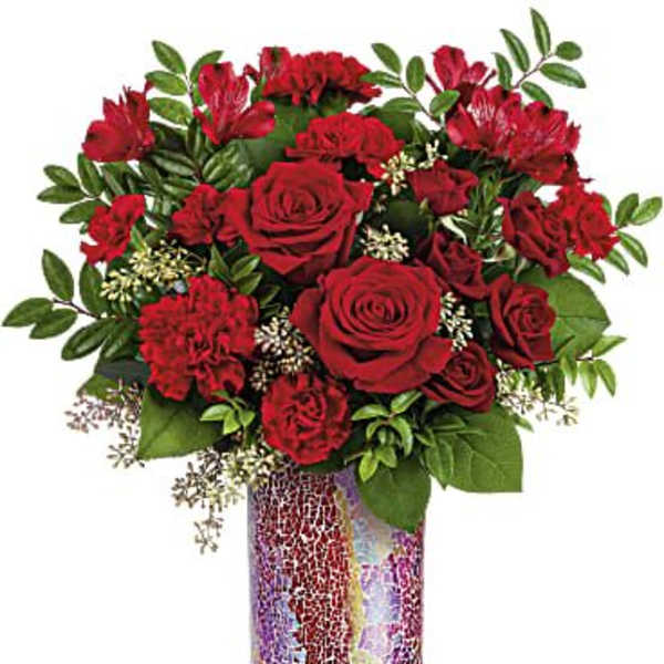 Red roses and carnations arranged in a mosaic vase