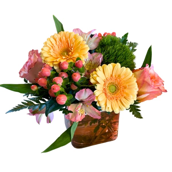 Bouquet of yellow gerbera daisies and pink flowers in an amber vase