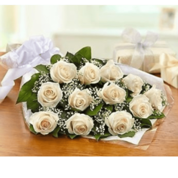 Bouquet of cream roses with baby's breath wrapped in white paper