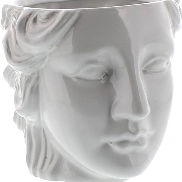 White sculpted face-shaped ceramic planter