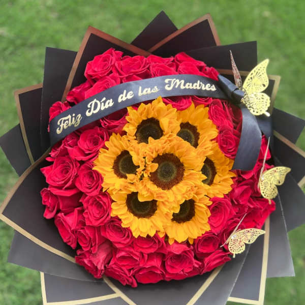 Bouquet of red roses and yellow sunflowers with a Mother's Day ribbon