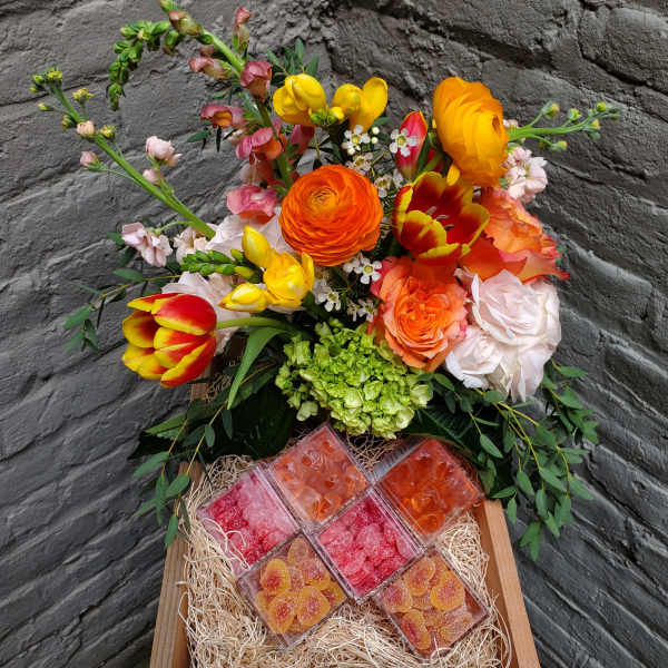 Mixed bouquet in a wooden box with assorted candy boxes