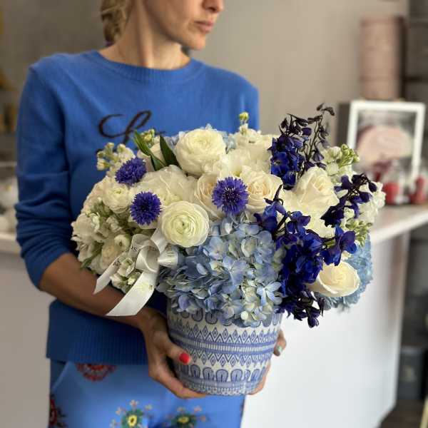 Blue and white bouquet in a patterned ceramic pot