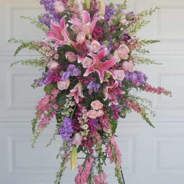 Tall pink and purple floral spray on a stand