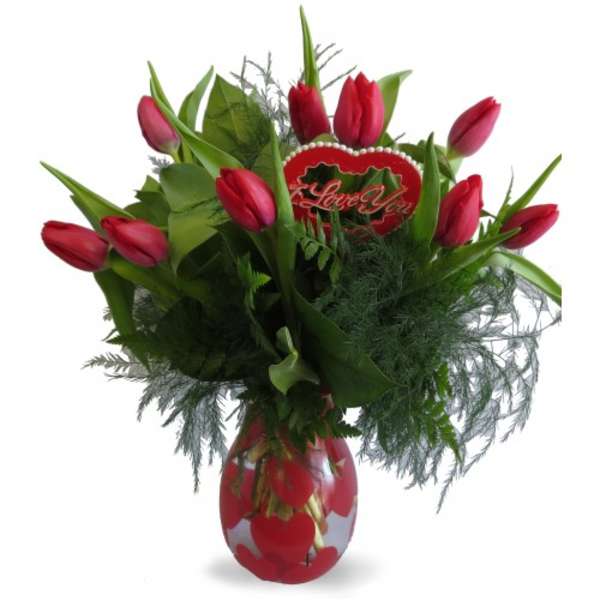 Red tulip bouquet in a heart-decorated vase with a love sign