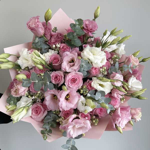 Pink and white bouquet of roses and lisianthus with eucalyptus