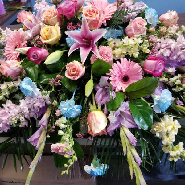 Large mixed bouquet with pink, purple, blue, and white flowers