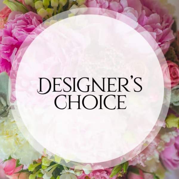 Pink and white floral arrangement with a Designer's Choice label