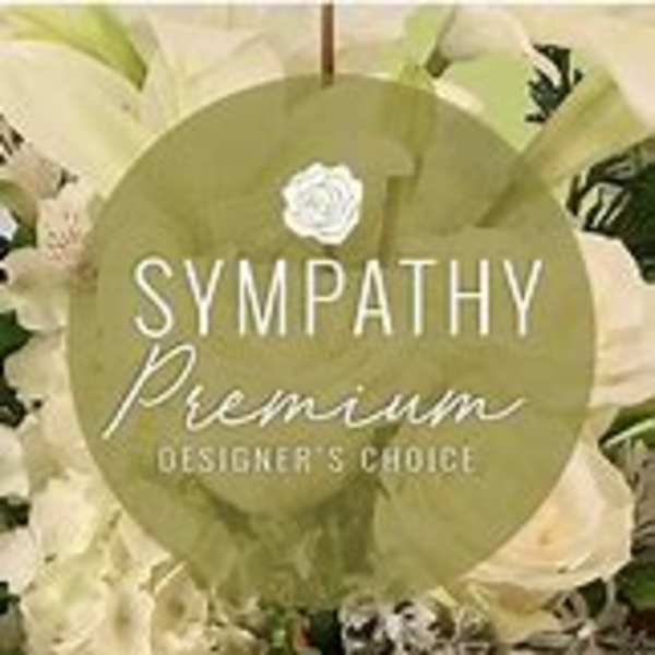 White floral arrangement with a sympathy premium label