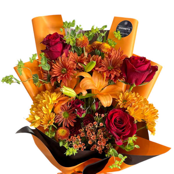 Bouquet of red roses, orange lilies, and yellow chrysanthemums wrapped in orange paper