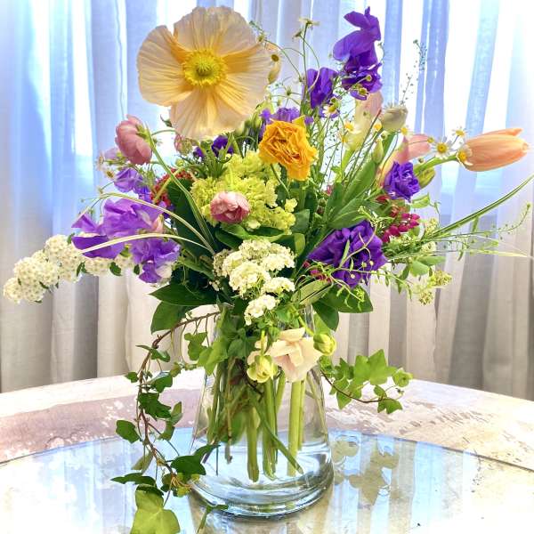 Colorful mixed bouquet in a clear glass vase