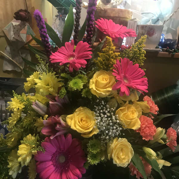 Bright mixed bouquet with pink gerbera daisies and yellow roses